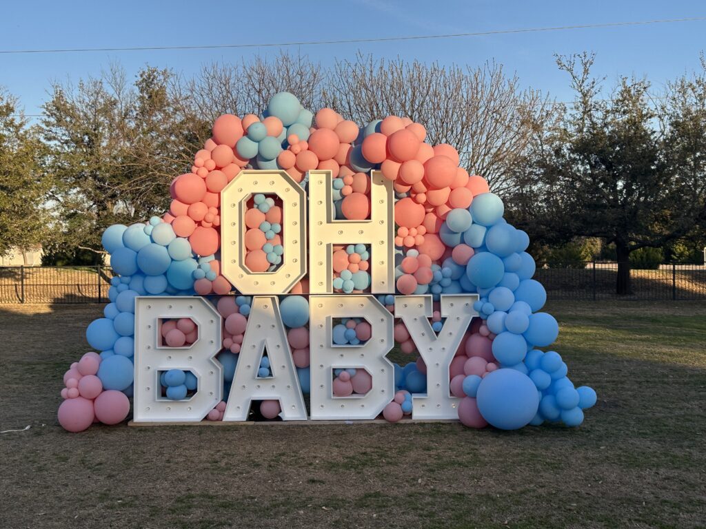 Gender reveal. marquees and balloons